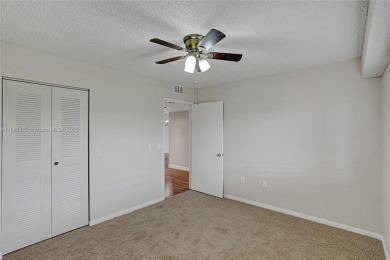 This substantially remodeled 2 bedroom with 2 baths is located on Flamingo Lakes Country Club in Florida - for sale on GolfHomes.com, golf home, golf lot