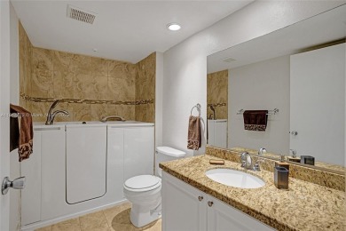 This substantially remodeled 2 bedroom with 2 baths is located on Flamingo Lakes Country Club in Florida - for sale on GolfHomes.com, golf home, golf lot