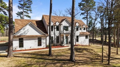 This exquisite custom home sits on the waterfront of hole #8 at on Eagles Bluff Golf Course in Texas - for sale on GolfHomes.com, golf home, golf lot
