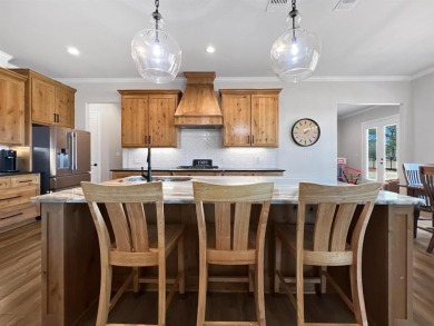 This exquisite custom home sits on the waterfront of hole #8 at on Eagles Bluff Golf Course in Texas - for sale on GolfHomes.com, golf home, golf lot