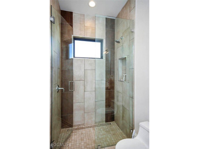 This Sanctuary home is ideally located on desirable Baltusrol Ct on The Sanctuary Golf Club in Florida - for sale on GolfHomes.com, golf home, golf lot