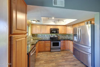 Beautifully maintained 4-bed, 3-bath tri-level townhome in gated on Dobson Ranch Municipal Golf Course in Arizona - for sale on GolfHomes.com, golf home, golf lot