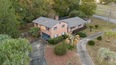 Welcome to 8755 Scenic Hills Dr -- a spacious and beautifully on Scenic Hills Country Club in Florida - for sale on GolfHomes.com, golf home, golf lot