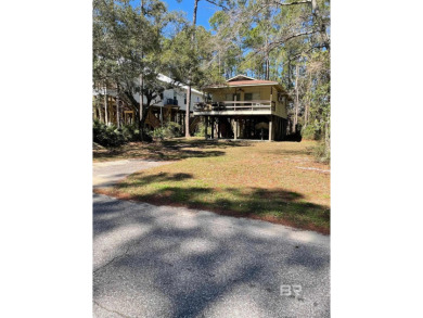 Beautiful wooded lot located on Dauphin Island near the Gulf of on Isle Dauphine Club Golf Course in Alabama - for sale on GolfHomes.com, golf home, golf lot