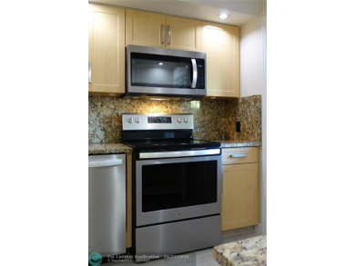 *Fully renovated first-floor condo in lush Palm Aire featuring on Palm-Aire Country Club and Resort - Palms in Florida - for sale on GolfHomes.com, golf home, golf lot
