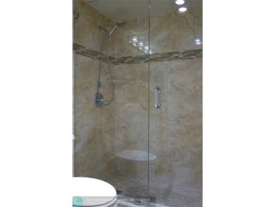 *Fully renovated first-floor condo in lush Palm Aire featuring on Palm-Aire Country Club and Resort - Palms in Florida - for sale on GolfHomes.com, golf home, golf lot