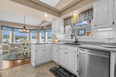 Lakefront living shines at this all-brick home on beautiful Lake on Ponce De Leon Golf Course in Arkansas - for sale on GolfHomes.com, golf home, golf lot