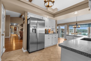 Lakefront living shines at this all-brick home on beautiful Lake on Ponce De Leon Golf Course in Arkansas - for sale on GolfHomes.com, golf home, golf lot