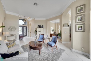 Over $100k of Updates, Impact Glass Windows on the front and on Heron Bay Golf Club in Florida - for sale on GolfHomes.com, golf home, golf lot