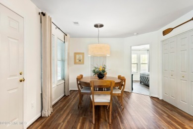 Welcome to this exceptional end-unit first-floor condominium on Carolina National Golf Club in North Carolina - for sale on GolfHomes.com, golf home, golf lot