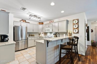 Welcome to this exceptional end-unit first-floor condominium on Carolina National Golf Club in North Carolina - for sale on GolfHomes.com, golf home, golf lot