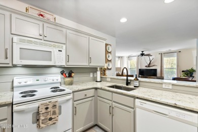 Welcome to this exceptional end-unit first-floor condominium on Carolina National Golf Club in North Carolina - for sale on GolfHomes.com, golf home, golf lot