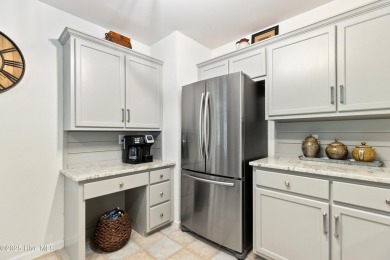 Welcome to this exceptional end-unit first-floor condominium on Carolina National Golf Club in North Carolina - for sale on GolfHomes.com, golf home, golf lot