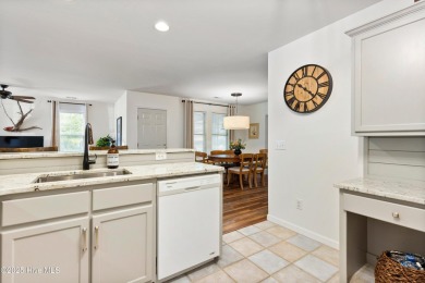 Welcome to this exceptional end-unit first-floor condominium on Carolina National Golf Club in North Carolina - for sale on GolfHomes.com, golf home, golf lot