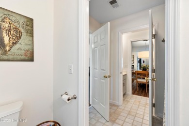 Welcome to this exceptional end-unit first-floor condominium on Carolina National Golf Club in North Carolina - for sale on GolfHomes.com, golf home, golf lot