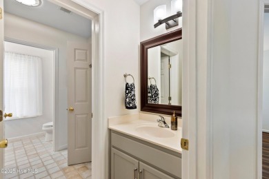 Welcome to this exceptional end-unit first-floor condominium on Carolina National Golf Club in North Carolina - for sale on GolfHomes.com, golf home, golf lot