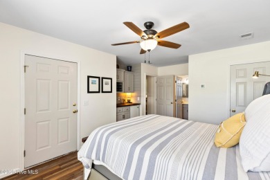 Welcome to this exceptional end-unit first-floor condominium on Carolina National Golf Club in North Carolina - for sale on GolfHomes.com, golf home, golf lot