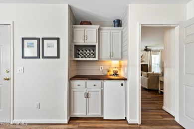 Welcome to this exceptional end-unit first-floor condominium on Carolina National Golf Club in North Carolina - for sale on GolfHomes.com, golf home, golf lot