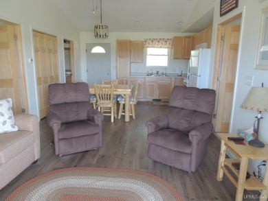 Just pack your bags and move right in to this immaculate totally on Nahma Club in Michigan - for sale on GolfHomes.com, golf home, golf lot