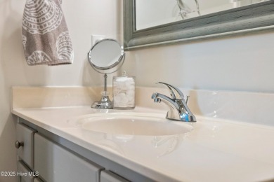 Welcome to this exceptional end-unit first-floor condominium on Carolina National Golf Club in North Carolina - for sale on GolfHomes.com, golf home, golf lot