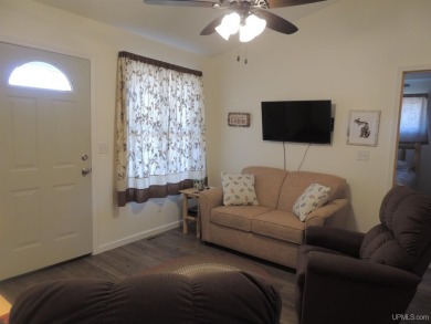 Just pack your bags and move right in to this immaculate totally on Nahma Club in Michigan - for sale on GolfHomes.com, golf home, golf lot