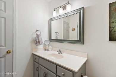 Welcome to this exceptional end-unit first-floor condominium on Carolina National Golf Club in North Carolina - for sale on GolfHomes.com, golf home, golf lot