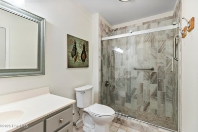 Welcome to this exceptional end-unit first-floor condominium on Carolina National Golf Club in North Carolina - for sale on GolfHomes.com, golf home, golf lot