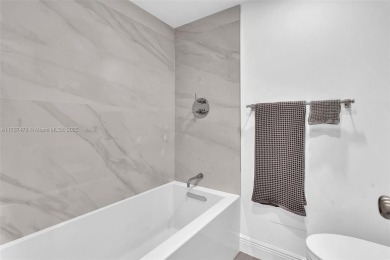 This beautiful 2 bedroom/ 2 bathroom condo has gorgeous views of on Turnberry Isle Resort and Club in Florida - for sale on GolfHomes.com, golf home, golf lot