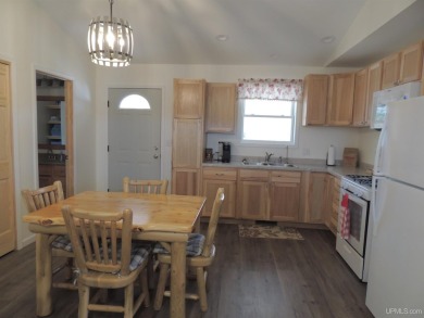 Just pack your bags and move right in to this immaculate totally on Nahma Club in Michigan - for sale on GolfHomes.com, golf home, golf lot