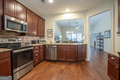 Welcome to easy, one-level living in this charming two-bedroom on Lanier Island Legacy Golf Couorse in Georgia - for sale on GolfHomes.com, golf home, golf lot