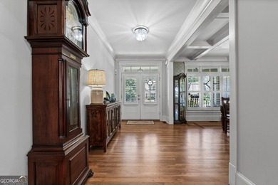 Experience panoramic views of the lake and golf course in this on Summergrove Golf Club in Georgia - for sale on GolfHomes.com, golf home, golf lot