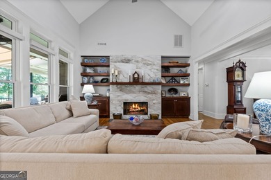 Experience panoramic views of the lake and golf course in this on Summergrove Golf Club in Georgia - for sale on GolfHomes.com, golf home, golf lot