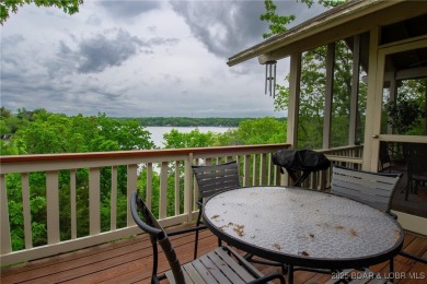 Welcome to your dream retreat in Tan Tar A Estates, an exclusive on The Oaks Golf Course in Missouri - for sale on GolfHomes.com, golf home, golf lot