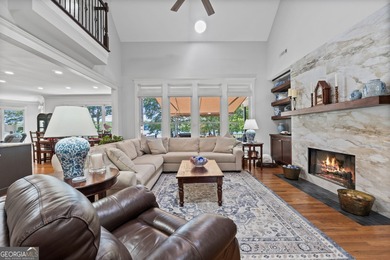 Experience panoramic views of the lake and golf course in this on Summergrove Golf Club in Georgia - for sale on GolfHomes.com, golf home, golf lot