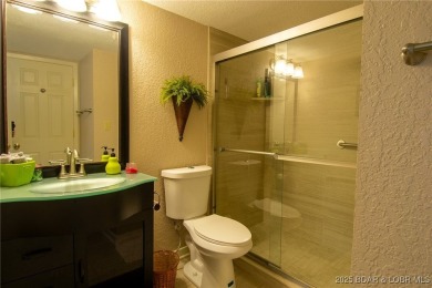 Welcome to your dream retreat in Tan Tar A Estates, an exclusive on The Oaks Golf Course in Missouri - for sale on GolfHomes.com, golf home, golf lot