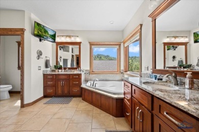 Tucked into nearly 3 acres of mature trees and peaceful hills on Spearfish Canyon Country Club in South Dakota - for sale on GolfHomes.com, golf home, golf lot
