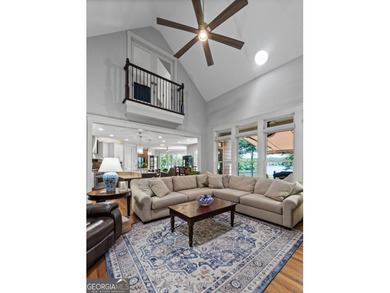 Experience panoramic views of the lake and golf course in this on Summergrove Golf Club in Georgia - for sale on GolfHomes.com, golf home, golf lot