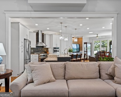 Experience panoramic views of the lake and golf course in this on Summergrove Golf Club in Georgia - for sale on GolfHomes.com, golf home, golf lot