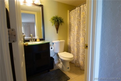 Welcome to your dream retreat in Tan Tar A Estates, an exclusive on The Oaks Golf Course in Missouri - for sale on GolfHomes.com, golf home, golf lot