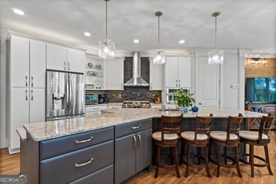 Experience panoramic views of the lake and golf course in this on Summergrove Golf Club in Georgia - for sale on GolfHomes.com, golf home, golf lot