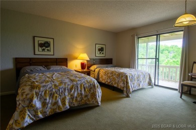 Welcome to your dream retreat in Tan Tar A Estates, an exclusive on The Oaks Golf Course in Missouri - for sale on GolfHomes.com, golf home, golf lot