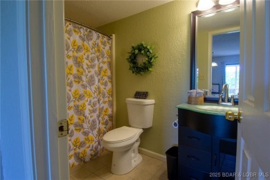 Welcome to your dream retreat in Tan Tar A Estates, an exclusive on The Oaks Golf Course in Missouri - for sale on GolfHomes.com, golf home, golf lot