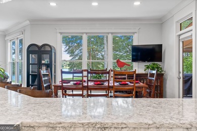 Experience panoramic views of the lake and golf course in this on Summergrove Golf Club in Georgia - for sale on GolfHomes.com, golf home, golf lot