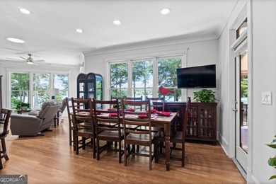 Experience panoramic views of the lake and golf course in this on Summergrove Golf Club in Georgia - for sale on GolfHomes.com, golf home, golf lot