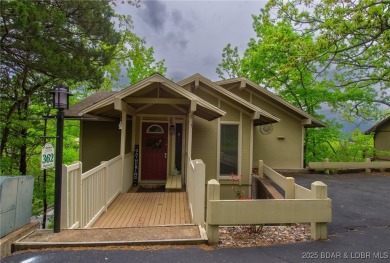 Welcome to your dream retreat in Tan Tar A Estates, an exclusive on The Oaks Golf Course in Missouri - for sale on GolfHomes.com, golf home, golf lot