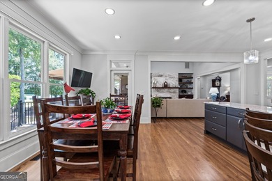 Experience panoramic views of the lake and golf course in this on Summergrove Golf Club in Georgia - for sale on GolfHomes.com, golf home, golf lot