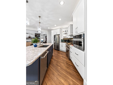 Experience panoramic views of the lake and golf course in this on Summergrove Golf Club in Georgia - for sale on GolfHomes.com, golf home, golf lot