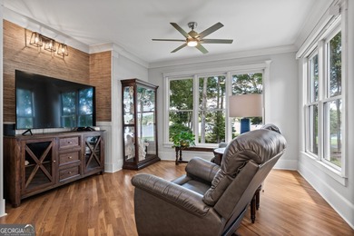 Experience panoramic views of the lake and golf course in this on Summergrove Golf Club in Georgia - for sale on GolfHomes.com, golf home, golf lot