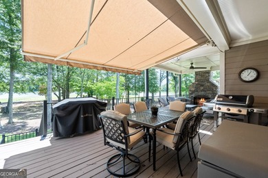 Experience panoramic views of the lake and golf course in this on Summergrove Golf Club in Georgia - for sale on GolfHomes.com, golf home, golf lot