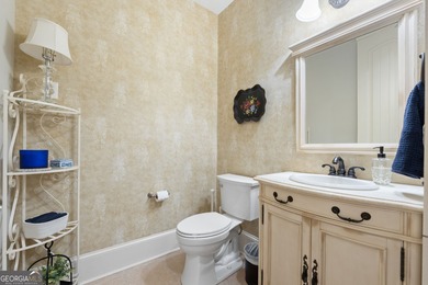 Experience panoramic views of the lake and golf course in this on Summergrove Golf Club in Georgia - for sale on GolfHomes.com, golf home, golf lot